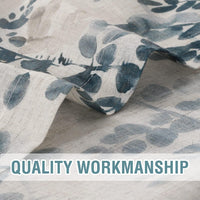 Semi-sheer floral curtain fabric with finished hem and stitching detail